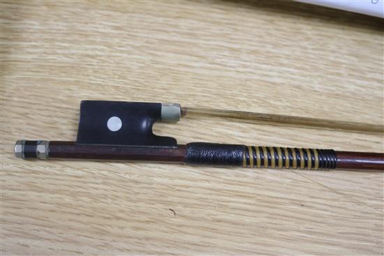 A violin bow by August Edwin Prager, nickel-mounted, stamped, L 74.5cm, 56gr